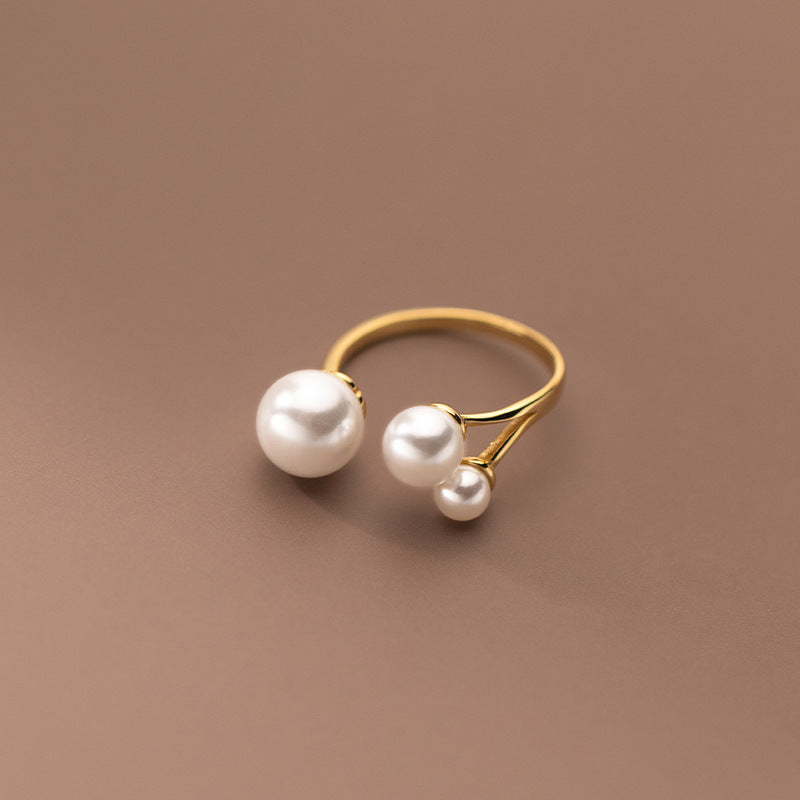 Adjustable Triple Freshwater Pearl Ring" can be rewritten as "Customizable Triple Freshwater Pearl Ring.