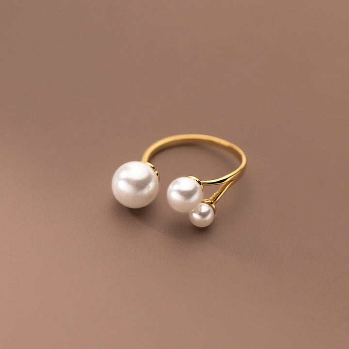 Adjustable Triple Freshwater Pearl Ring" can be rewritten as "Customizable Triple Freshwater Pearl Ring.