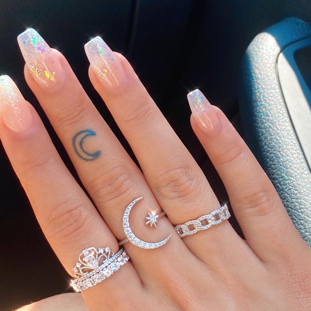 Silver Ring Featuring Moon and Star Design